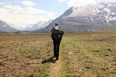 Rear view of man standing on land