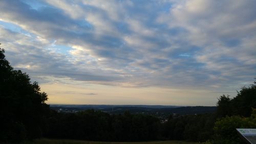 Scenic view of landscape against cloudy sky