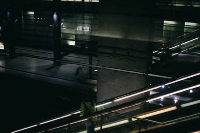 High angle view of illuminated escalator at night