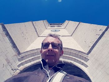 Portrait of man wearing sunglasses against sky