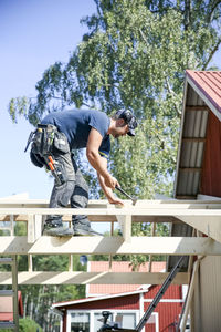 Carpenter working on roof
