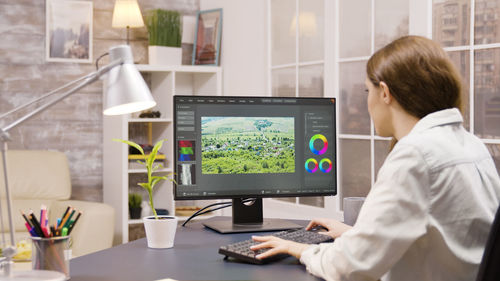 Side view of businessman working at office