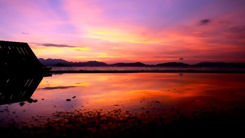 Scenic view of lake at sunset