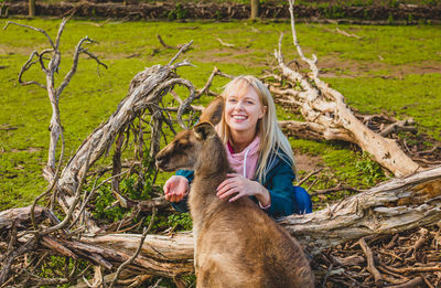 Portrait of a smiling young woman in park