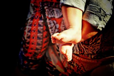 Low section of man wearing shoes