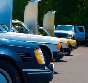 Close-up of vintage cars on road