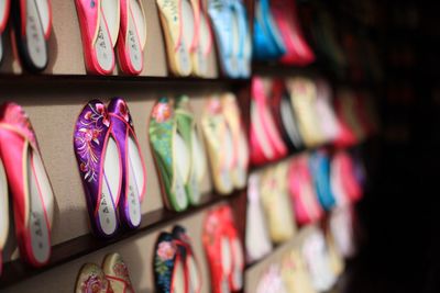 Close-up of multi colored shoes for sale