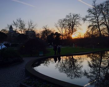 Scenic view of lake at sunset