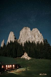 Scenic view of mountains against sky at night