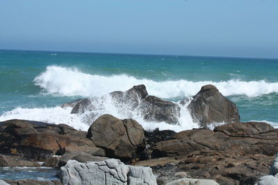 Waves splashing on rocks at shore