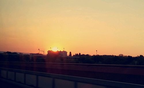 Silhouette of road against sky during sunset