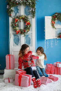 Portrait of woman with christmas tree