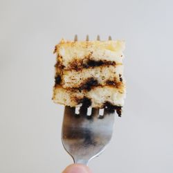 Close-up of cake against white background