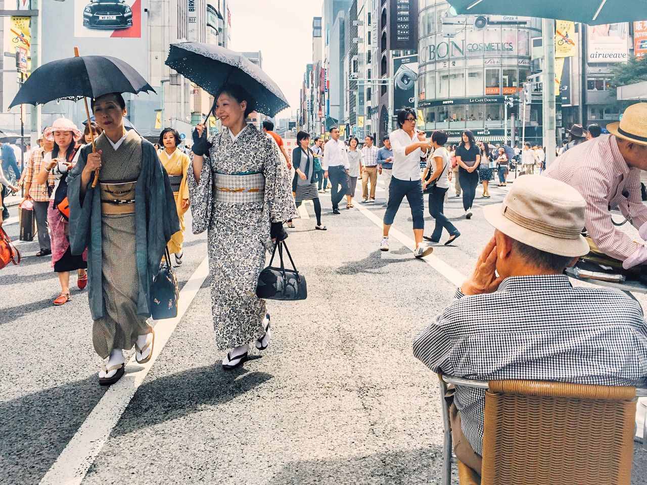 street, city, men, building exterior, person, city life, large group of people, built structure, architecture, walking, lifestyles, incidental people, market, road, day, outdoors, sunlight, leisure activity, animal themes