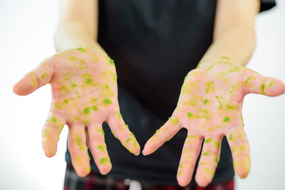 Close-up of hand holding painting