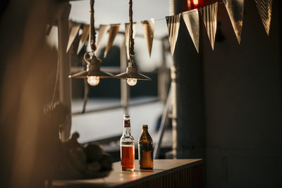 Beer bottles on table on boat