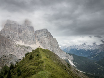 Scenic view of monte pelmo against cloudy sky