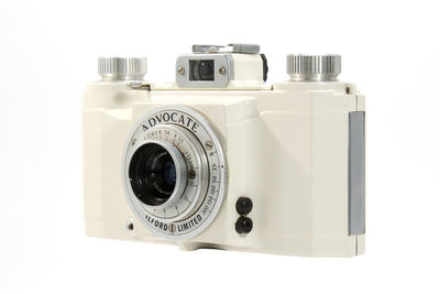 Close-up of camera over white background