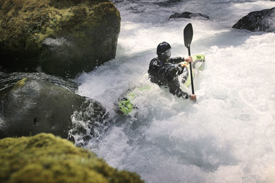 High angle view of man kayaking in river
