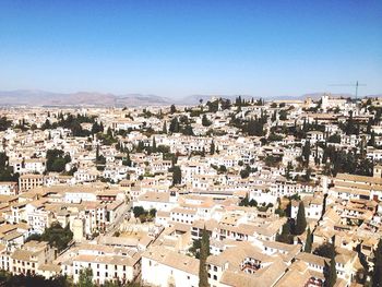 Aerial view of cityscape against clear sky