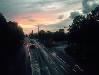 Road against cloudy sky at sunset