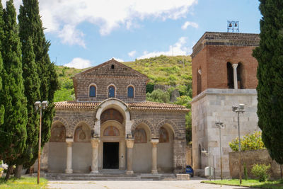 Facade of historic building against sky