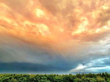 Scenic view of dramatic sky during sunset