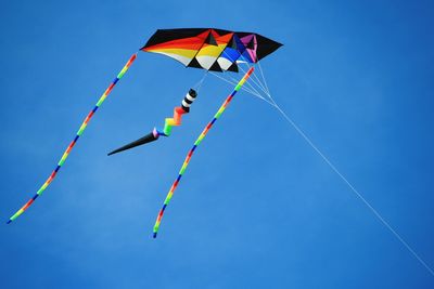 Low angle view of kite flying in sky