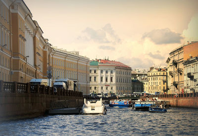 Panoramic view of buildings by sea against sky