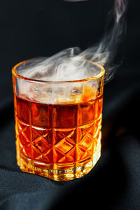 Close-up of drink against black background