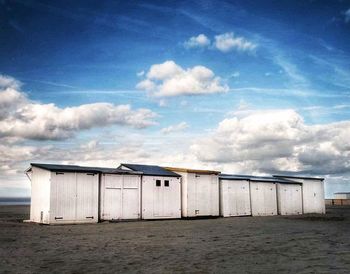 Built structure on beach against sky