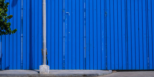 Blue metal door of building