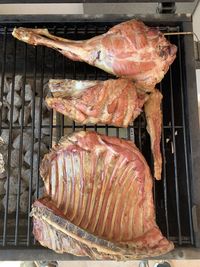 High angle view of meat on barbecue grill