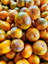 Full frame shot of oranges at market stall