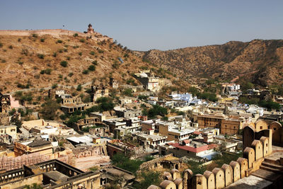 High angle view of townscape and mountains