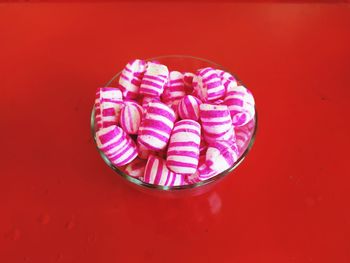 High angle view of ice cream on red table