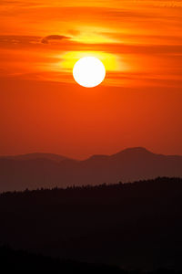 Scenic view of silhouette landscape against romantic sky at sunset