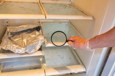 High angle view of man working in kitchen