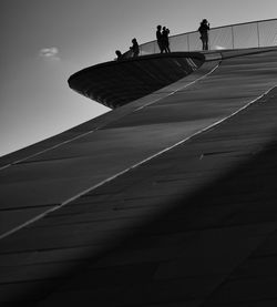 Low angle view of people walking on staircase