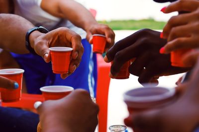 Close-up of hands holding coffee cup