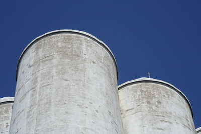 Low angle view of water tower against clear sky