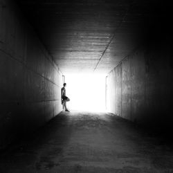 Man standing in tunnel