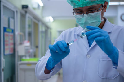 Rear view of people working