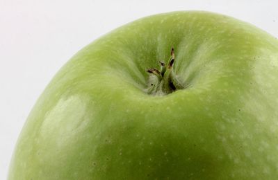 Close-up of fruit over white background