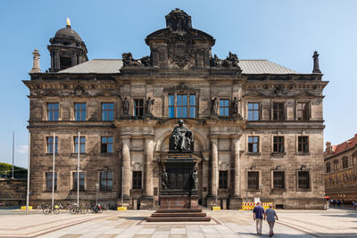 Facade of old building against clear sky