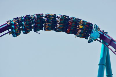 Low angle view of amusement park ride against sky