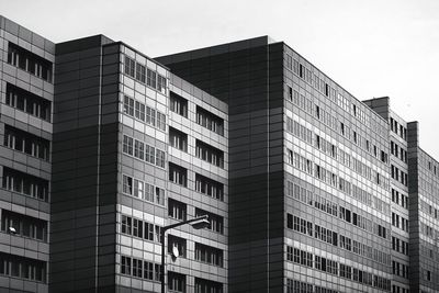 Low angle view of modern buildings against sky