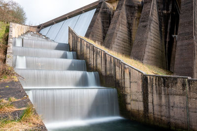 Long exposure of the waterfalls flowing over wimbleball dam in somerset 