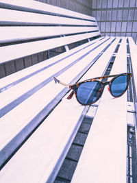 Low angle view of sunglasses on swimming pool