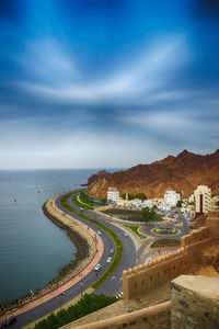 High angle view of road by sea against sky